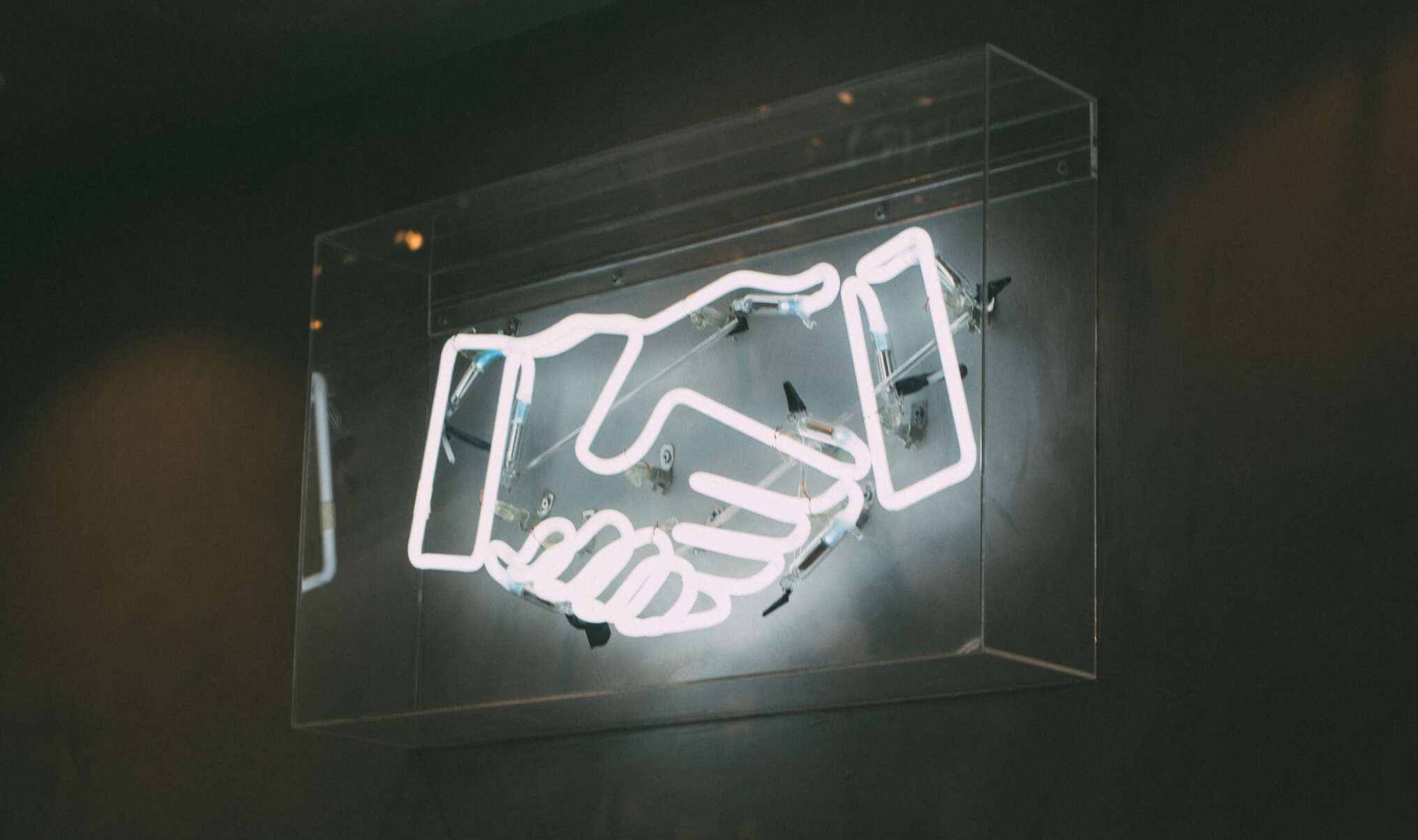 Neon handshake unsplash free
